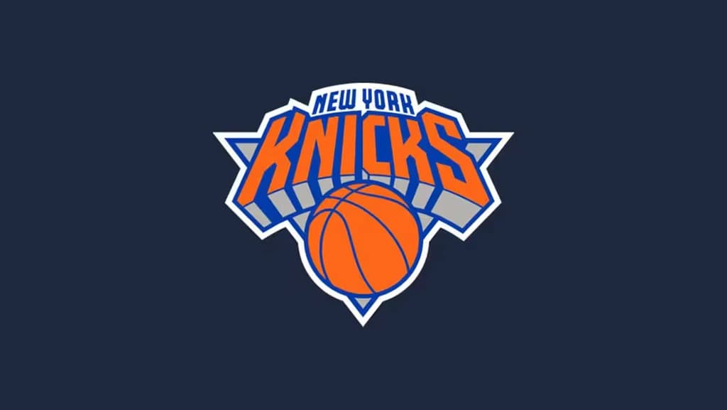 Fans enjoying a Knicks basketball game at Madison Square Garden with a clear view of the action on the court.