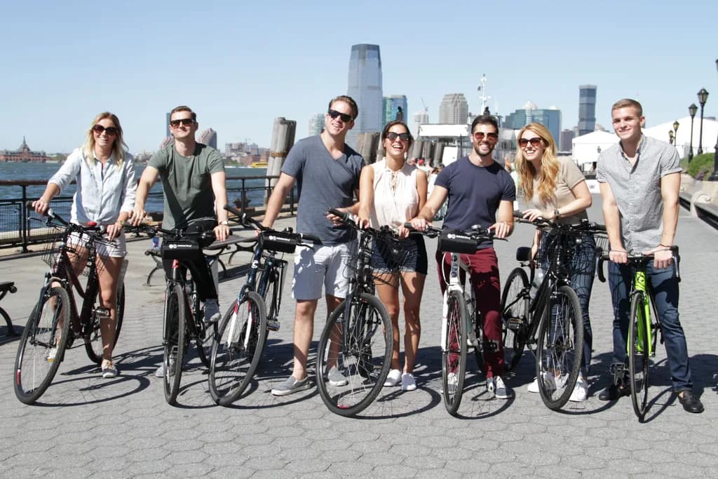 a group of people on bikes smiling at the camera